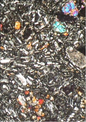 Fenokris terdiri dari plagioklas, piroksen, mineral opak, berukuran mencapai, mm, dengan bentuk kristal euhedral anhedral.